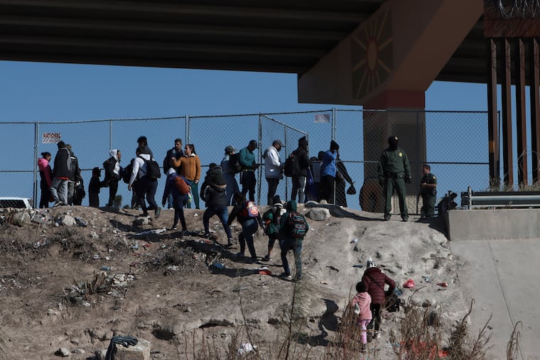 Migrants cross the U.S.-Mexico border from Ciudad Juarez, Mexico, and turn themselves into U.S. Border Patrol agents, Monday, Dec. 19, 2022. Pandemic-era immigration restrictions in the U.S. known as Title 42 remain controversial.