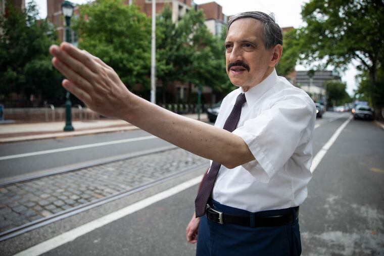 Mark D. Sanders of Ogontz, president of the Philadelphia Street Railway Historical Society, talks about construction that threatens the last bit of historic Belgian block paving under the trolley tracks on South 40th Street in University City.