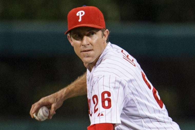 Chase Utley fields the ball during the eighth inning of a baseball game, Wednesday, Aug. 7, 2013, in Philadelphia. Chicago won 5-2. (Christopher Szagola/AP)