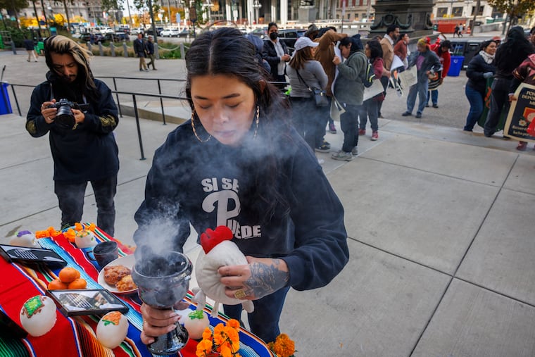 Erika Guadalupe Nuñez, Executive Director Juntos, blessed the altar with incense before the start of the rally. Members of the End Medical Deportation Campaign gathered outside Philadelphia City Hall to ask city council members to approve Bill 230649. The bill calls to end the practice of private medical deportation. This photograph was taken at a rally on the north side of city hall on Wednesday, November 1, 2023.