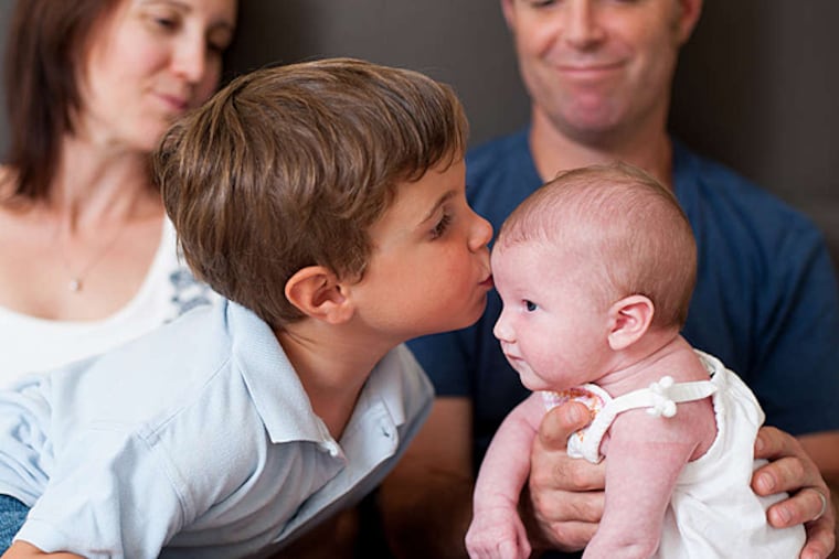 Lev Samuel and his sister, Natalie Grace, with parents Kristin Romens and Matt Eskin. (REGINA MILLER / Origin Photo)