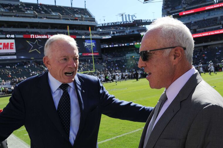 Dallas Cowboys owner Jerry Jones (left) has run his franchise's daily operations since 1996, to minimal success. For better or worse, Eagles owner Jeffrey Lurie is becoming more like him every day.