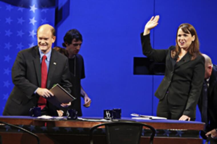 Delaware US Senate debate. Democrat Chris Coons, left and Republican Christine O'Donnell after debating at Mitchell Hall at the University of Delaware in Newark Delaware, Wednesday, October 13, 2010. ( Steven M. Falk / Staff Photographer )