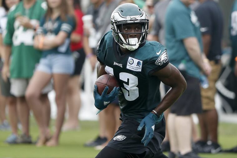 Eagles receiver Nelson Agholor heads up the field at training camp on Friday.