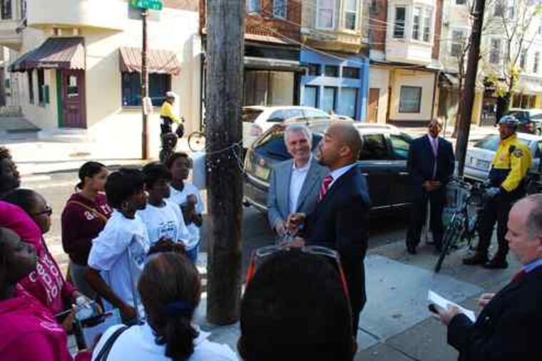 Class is in session outside the Famous 4th Street Deli in Queen Village. Will Mega (center) talks to the students while gubernatorial candidate Tom Knox awaits his turn.