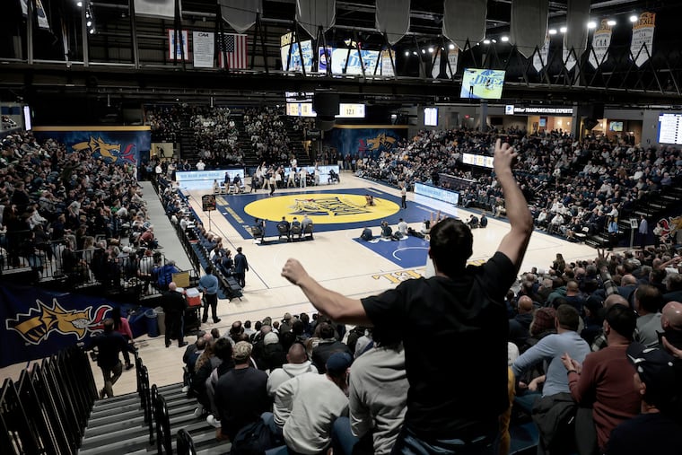 Sean Kelly of Doylestown cheers for his brother, Drexel wrestler Patrick Kelly, during the Dragons' men's wrestling match vs. Penn State on Friday at a sold-out Daskalakis Athletic Center.