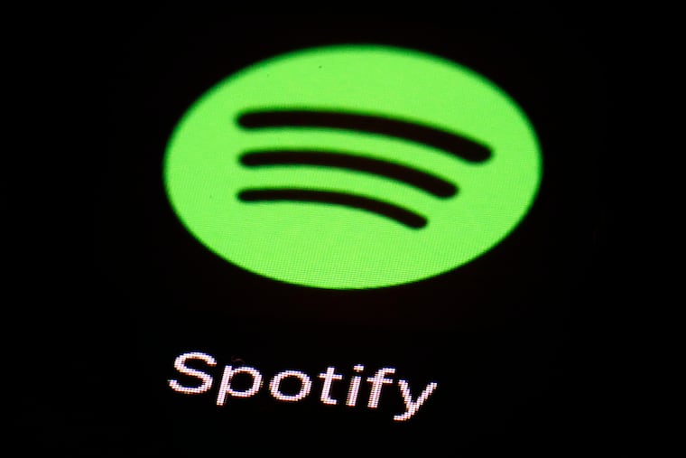 This 2018 file photo shows the Spotify app on an iPad in Baltimore.