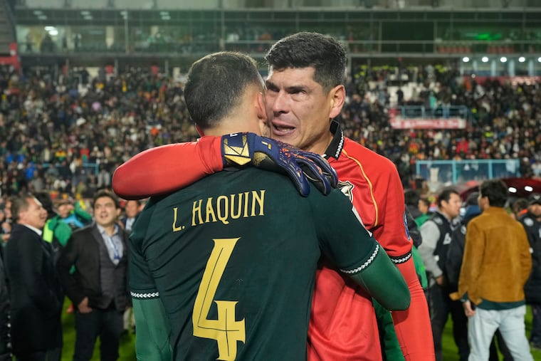Bolivia's goalkeeper Carlos Lampe (right) celebrates with teammate Luis Haquin following their team's 1-0 victory against Brazil in a 2026 World Cup qualifying match on Sept. 9, 2025.