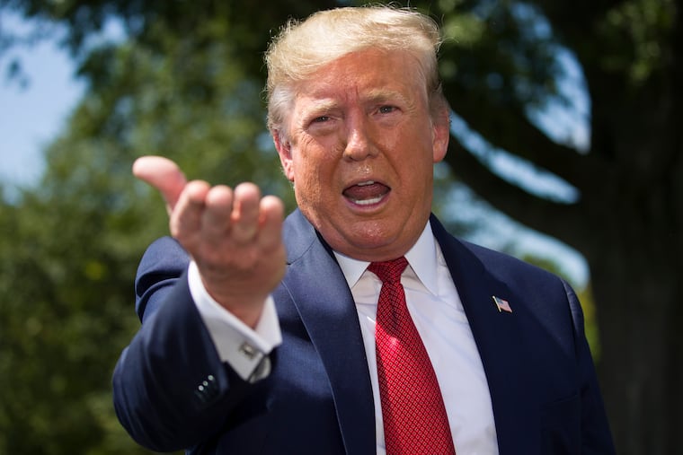 President Donald Trump speaks with reporters before departing on Marine One on the South Lawn of the White House on Wednesday.