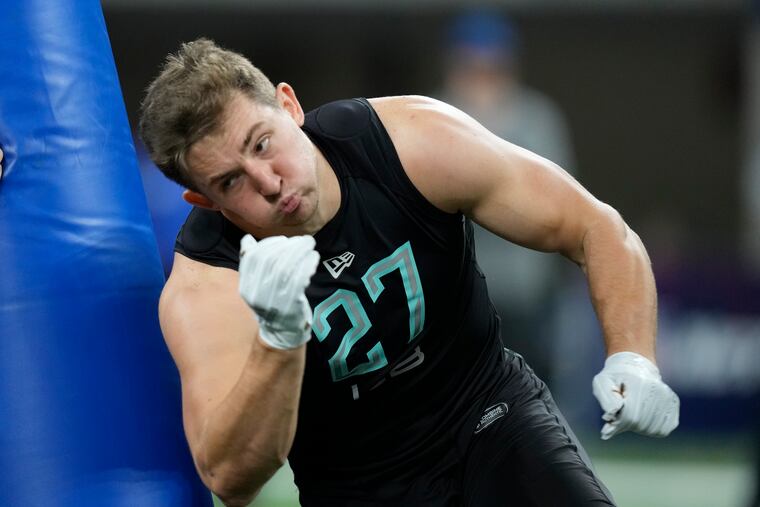 Wyoming linebacker Chad Muma runs a drill at the NFL football scouting combine, Saturday, March 5, 2022, in Indianapolis. (AP Photo/Charlie Neibergall)