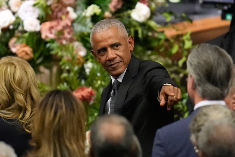 Former President Barack Obama arrives for Friday's memorial service for the Rev. Jesse Jackson at the House of Hope in Chicago.