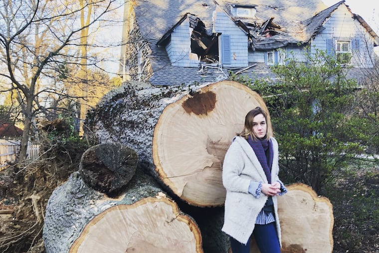 Courtenay Harris Bond in front of the tree that fell on her house after a Nor-Easter in March 2018.