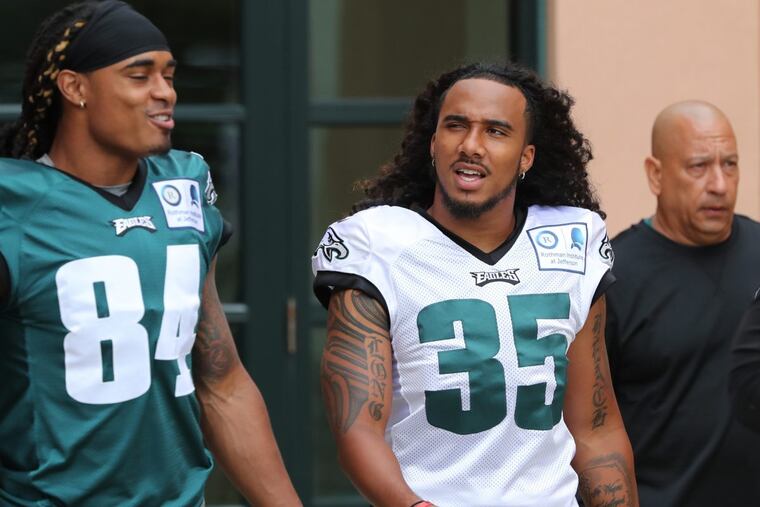 Philadelphia Eagles' Marcus Johnson (84) and Randall Goforth (35) take to the field during training camp at the NovaCare Complex Tuesday July 25, 2017. ( DAVID SWANSON / Staff Photographer )