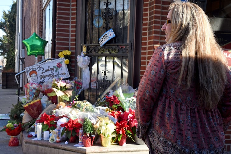 A 2018 memorial for Marie Buck, 81, gunned down in the grocery store she ran for four decades. TOM GRALISH / Staff Photographer