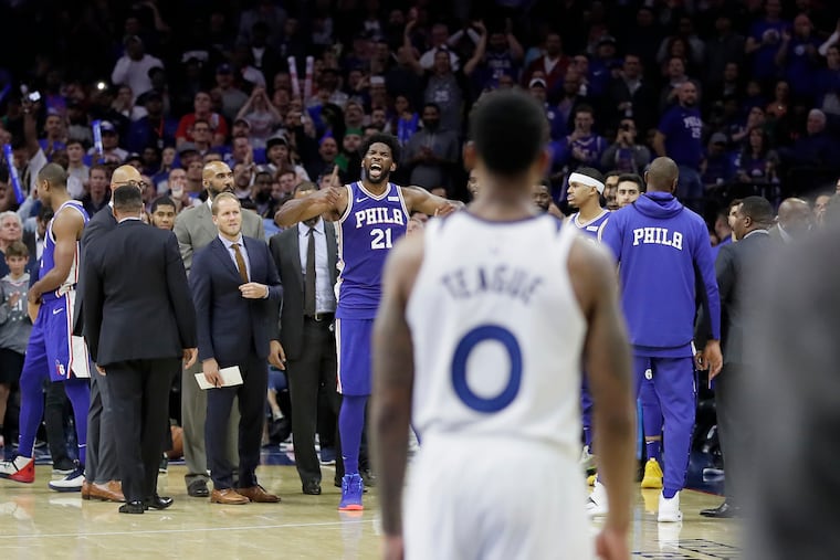 Sixers Joel Embiid reacts after learning he is ejected from the game after a third quarter altercation with the Timberwolves' Karl-Anthony Towns.