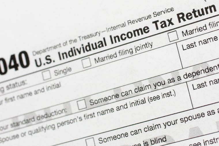 A portion of the 1040 U.S. Individual Income Tax Return form from 2018 is shown.