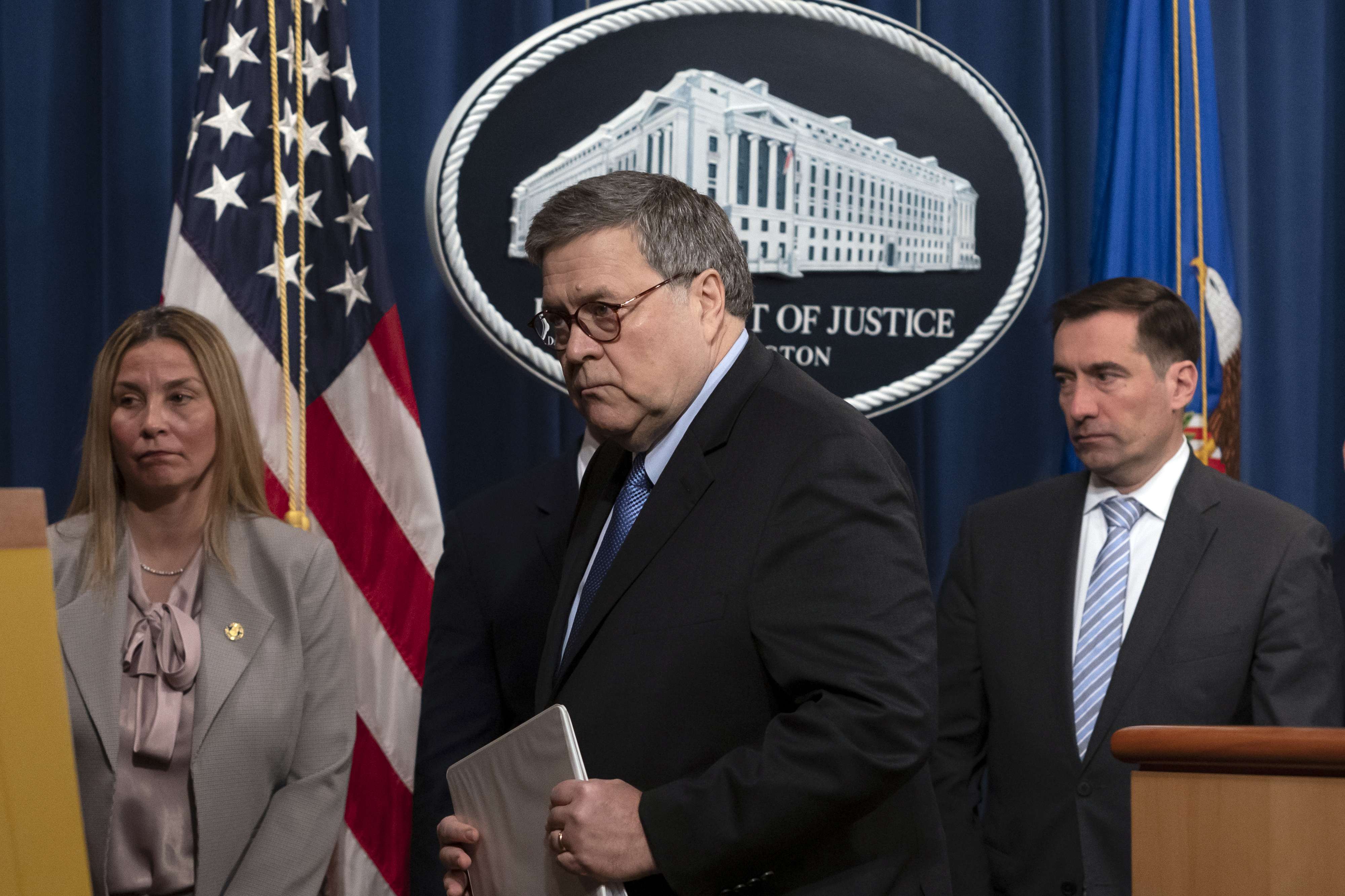 Attorney General William Barr leaves a news conference after speaking to reporters at the Justice Department in Washington, Monday, Jan. 13, 2020, to announce the results of an investigation of the shootings at the Pensacola Naval Air Station that happened in Florida on Dec. 6, 2019. Barr wants Apple to unlock the shooter's iPhones.