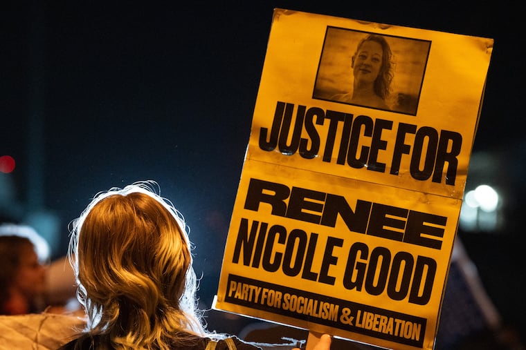 A demonstrator holds a sign memorializing Renee Good during a protest outside an ICE facility in Pflugerville, Texas, on Thursday.