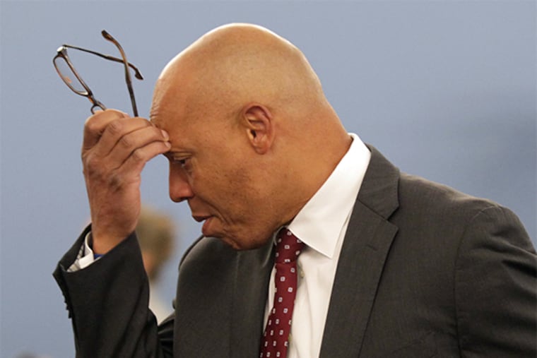 Superintendent of The School District of Philadelphia William Hite scratches his head while arriving to a public meeting to adopt a operating budget for 2014/2015 at the Philadelphia School District Building on Monday, June 30, 2014. ( YONG KIM / Staff Photographer )