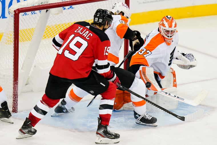 Brian Elliott stops a shot by the New Jersey Devils' Travis Zajacduring the third period of the Flyers' 5-3 win Tuesday. The teams will meet again Thursday in New Jersey, with Carter Hart in the nets for the Flyers.
