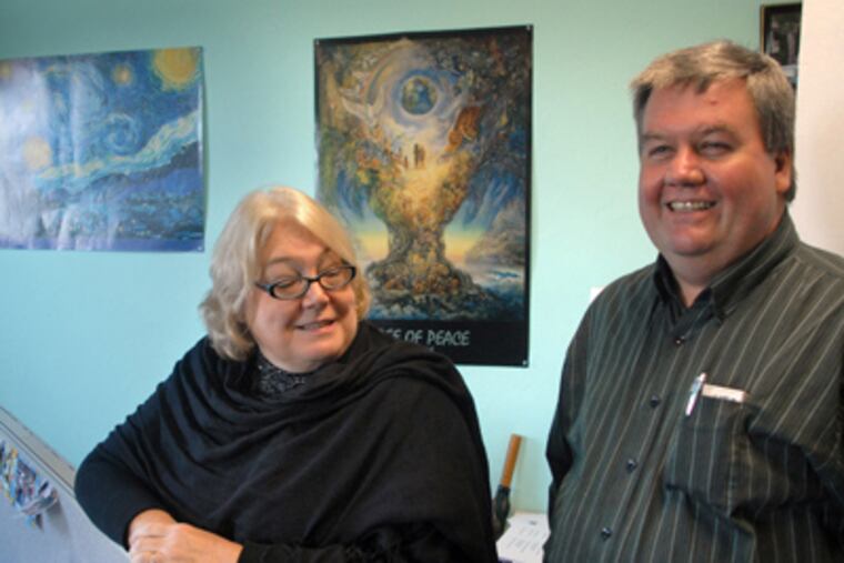 Executive director Sandy Salzman and Tom Potts, head of the neighborhood advisory committee, relax at offices of the New Kensington Community Development Corp. (Tom Gralish / Staff Photographer)