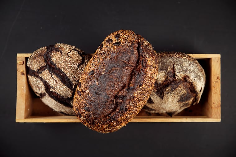 From left, buck honey rye, seedy grain, and homadama loaves are pictured at Lost Bread Co.'s baking facility in Craft Hall in Philadelphia's Northern Liberties section on Tuesday, Sept. 24, 2019.