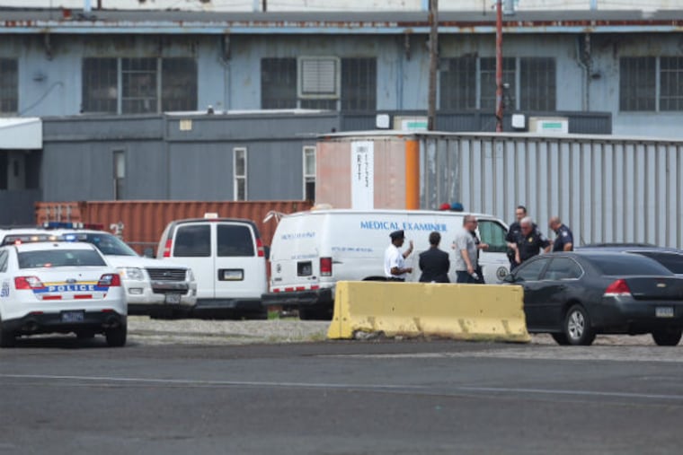 Emergency crews at the scene near the Delaware River where a body was found on a ship arriving in Philadelphia on May 11, 2015. (David Swanson / Staff Photographer)