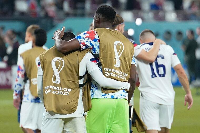 The U.S. team walks off the pitch after losing to the Netherlands at Khalifa International Stadium in Rayyan, Qatar, during the Round of 16 of the FIFA World Cup 2022.