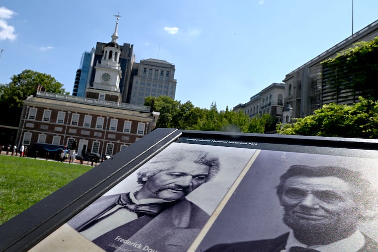 A panel titled “Intoning Inspiration” in front of Independence Hall in Independence National Historical Park Monday, July 28, 2025, shows three Americans who spoke at the Hall and Liberty Bell. Abolitionist Frederick Douglass (left) gave a speech against slaveholding in 1844; President-elect Abraham Lincoln (right) stopped on his inaugural journey to Washington D.C. in 1861 and pondered the meaning of “all men are created equal; ” and Suffragette Susan B. Anthony (not shown) and others disrupted the nation's centennial celebration on July 4, 1876 to read the “Declaration of the Rights of Women of the United States.”