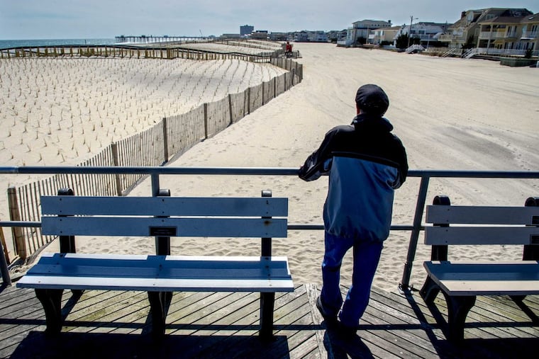 Looking toward Margate’s new dunes (left), resident Glenn Klotz stands where the Ventnor boardwalk ends – the border between the two towns. He would like to see the boardwalk extended into Margate.