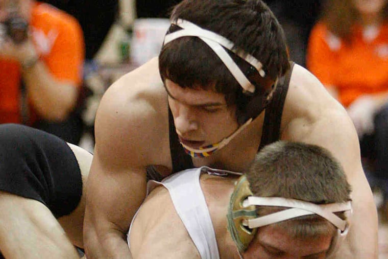 Cherokee's Ben Fanjoy (top), an Olympic American first-team 160-pound all-star, grapples with Camden Catholic's Mike McBride in a Jan. 31 wrestling match.