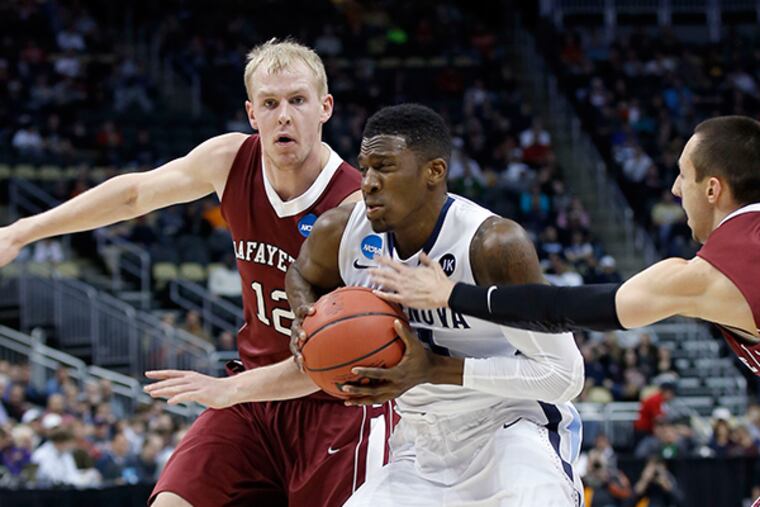 Villanova's Dylan Ennis drives to the basket against Lafayette's Seth
Hinrichs (left) and Joey Ptasinski. (Yong Kim/Staff Photographer)