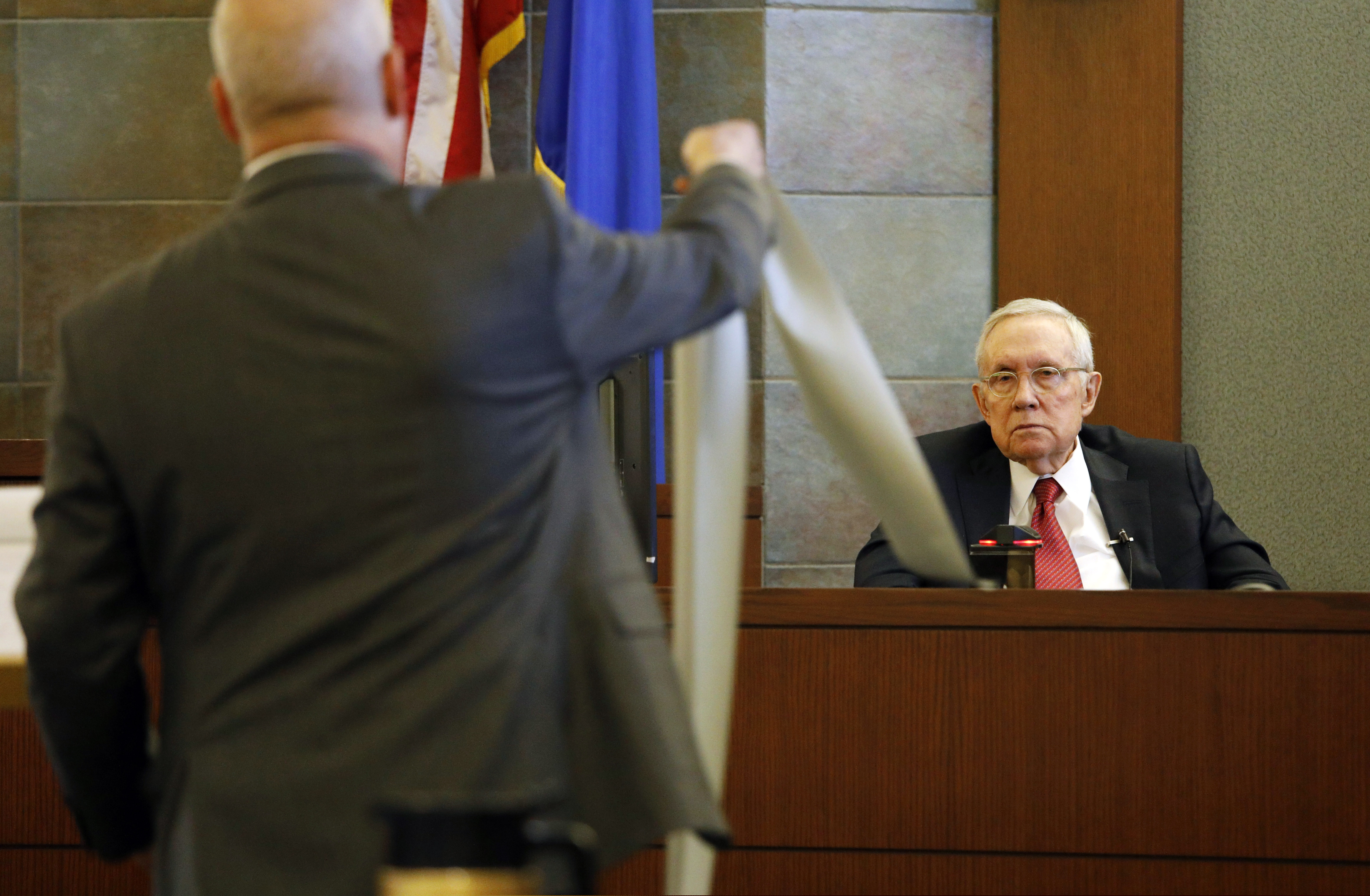 Former U.S. Sen. Harry Reid sits in the witness stand, Thursday, March 28, 2019, in Las Vegas. Reid testified in his negligence lawsuit against the maker of an exercise device. (AP Photo/John Locher)