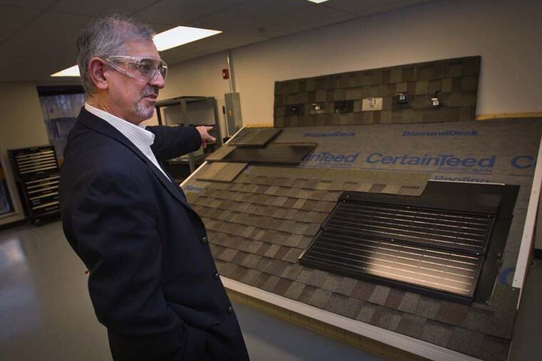 Minas Apelian, Vice President for Research and Development for CertainTeed and Global Director External Venturing at St. Gobain Malvern Innovation Center, stands next to an Apollo II solar integrated roof panel on Mar. 9, 2015 at 18 Moores Road, in Malvern, Pa. (Alejandro A. Alvarez / Staff Photographer)