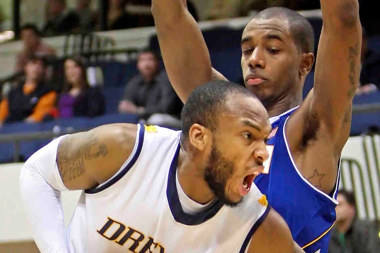 Drexel's Samme Givens drives on Hofstra defender David Imes on his way to a career-high 25 points. But despite Givens' offensive heroics, the Dragons fell short against the visiting Pride.