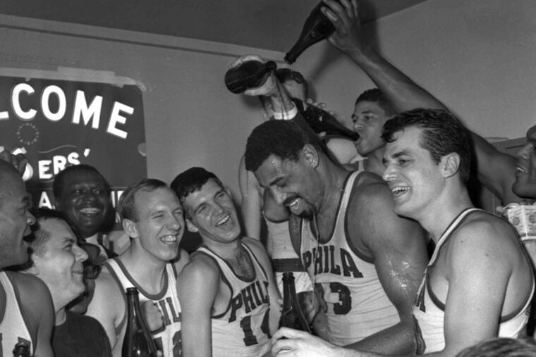Wilt Chamberlain (13) celebrates 1967 Eastern Conference title with 76ers teammates and best friend Vince Miller.
