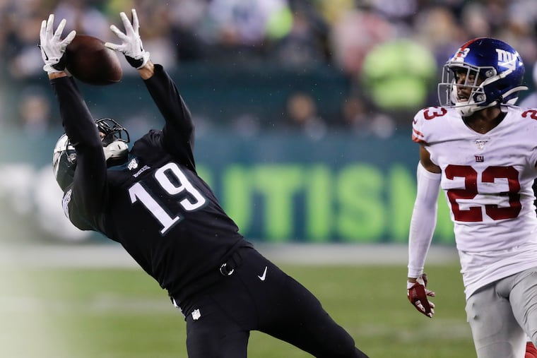 Eagles wide receiver J.J. Arcega-Whiteside catching the football past Giants defensive back Sam Beal during the fourth quarter Monday.