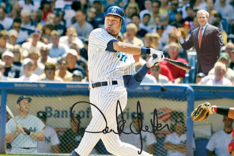 President Bush and Mickey Mantle aren't really watching Derek Jeter swing. The Topps card was digitally altered. (See "Jeter's card.")