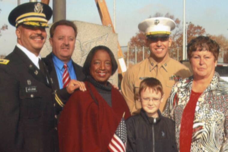 District Attorney Seth Williams (far left) and City Councilwoman Marian Tasco (second from left) joined members of the Lawncrest Community Association at the neighborhood’s annual Veterans Day celebration last week. Kathy Wersinger / FOR THE DAILY NEWS
