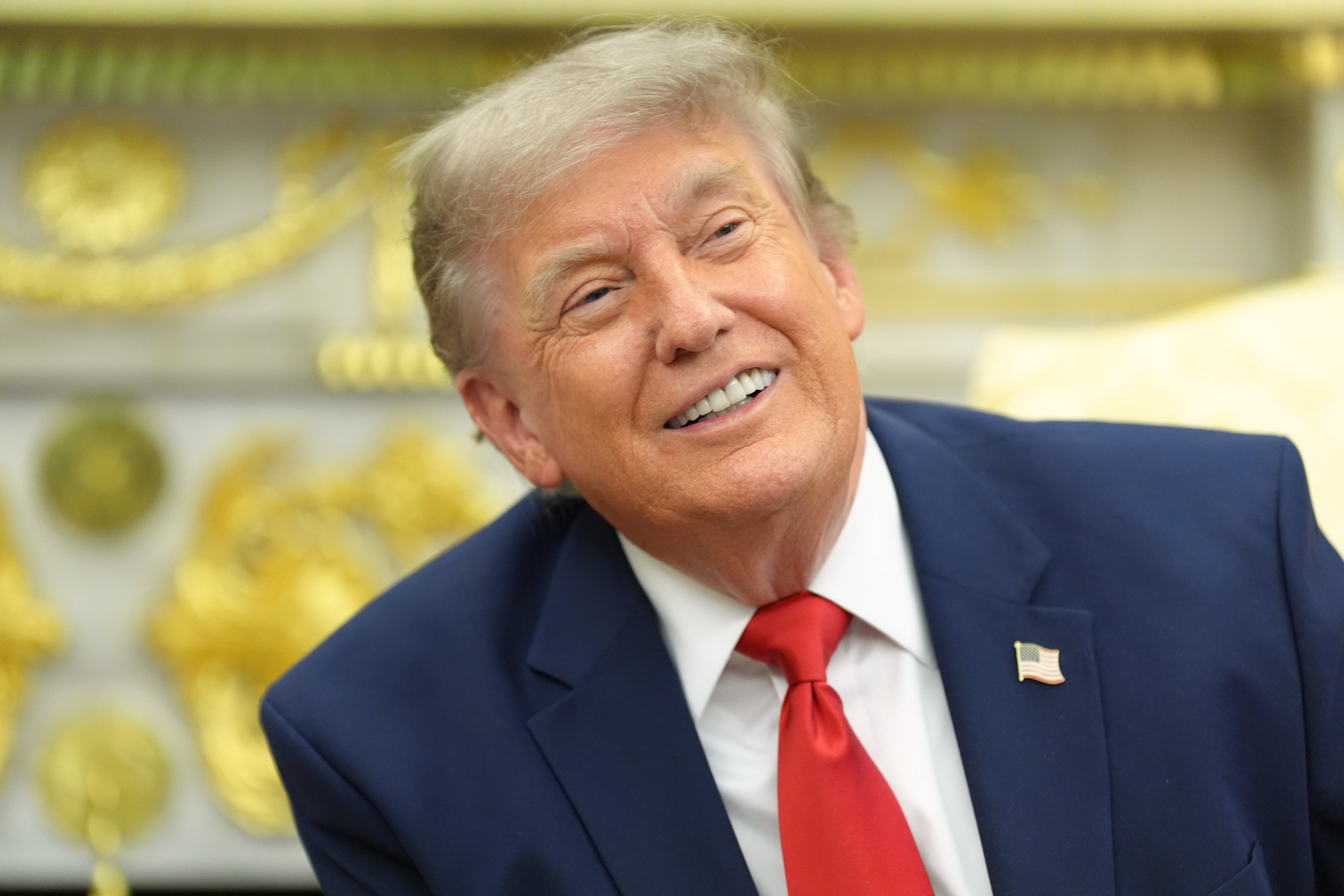 Trump rings Wall Street's opening bells as he ties his presidency to stock market gains