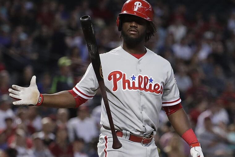 Philadelphia Phillies Odubel Herrera (37) tosses hit bat after a strike during the first inning of a baseball game against the Arizona Diamondbacks, Monday, June 26, 2017, in Phoenix.