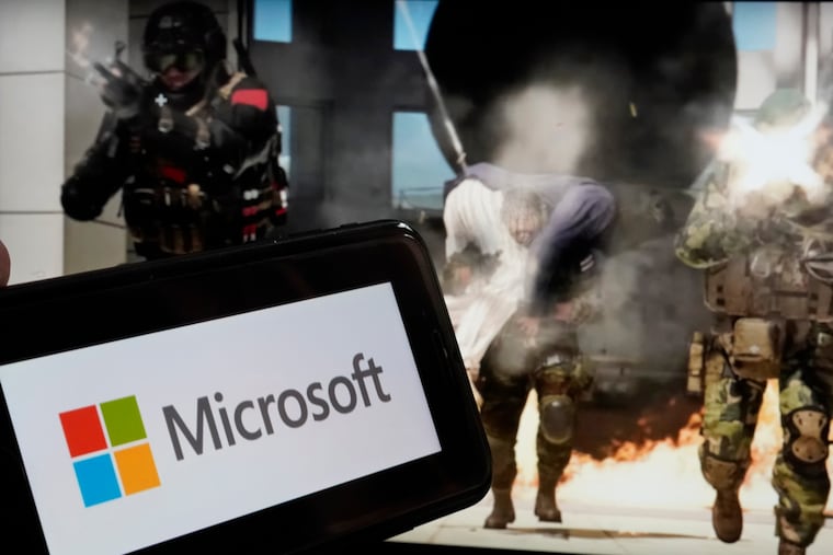 The logo for Microsoft, and a scene from Activision "Call of Duty - Modern Warfare"