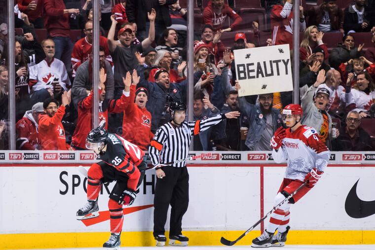 Morgan Frost (left) celebrates his third goal during Canada's blowout of Denmark on Wednesday at the World Junior Championship.