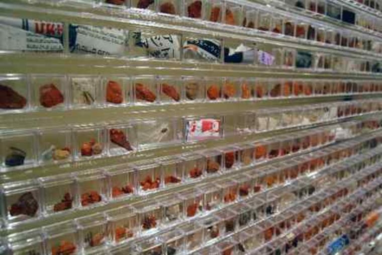 "Tsunagu-Wall," by Keiko Miyamori (2009), is made up of about 4,000 clear plastic boxes containing fragments that include brick, concrete, and metal.