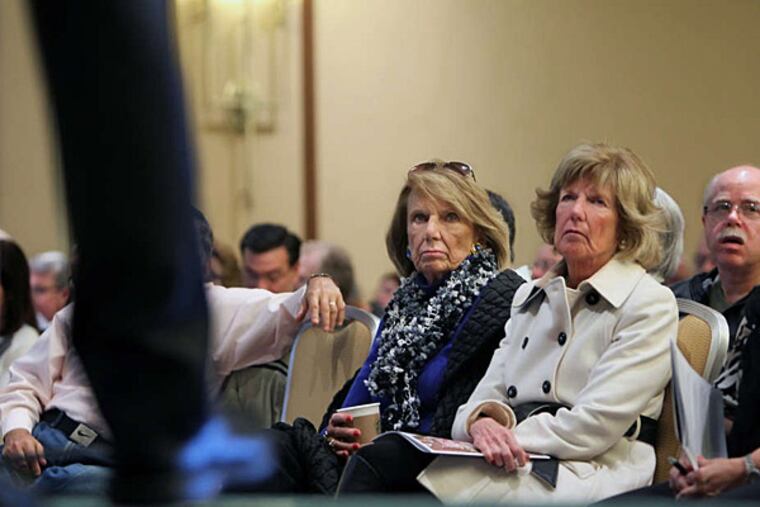 Cathy Schumacher (left) and her sister, Marita Fisher, listen to Columbia professor Michael Sparer discuss the future of health care at the One Day University event. (Michael Bryant/Staff)