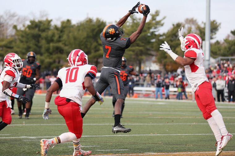Woodrow Wilson's Travon King (7) catches a pass for a touchdown in the third quarter of the South Jersey Group 3 championship game against Delsea at Rowan University's Richard Wackar Stadium in Glassboro, N.J., on Saturday, Dec. 2, 2017. Delsea won 29-28. TIM TAI / Staff Photographer