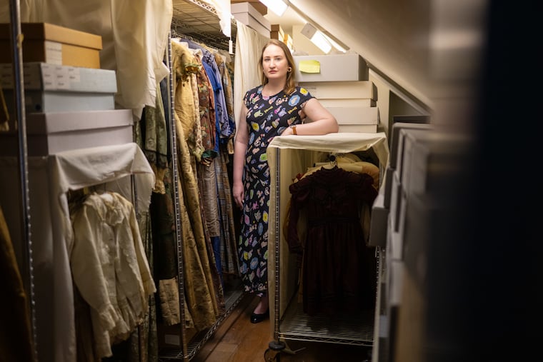 Kaila Temple, the Germantown Historical Society's curator of collections, with a portion of the 5,000-piece costume collection.