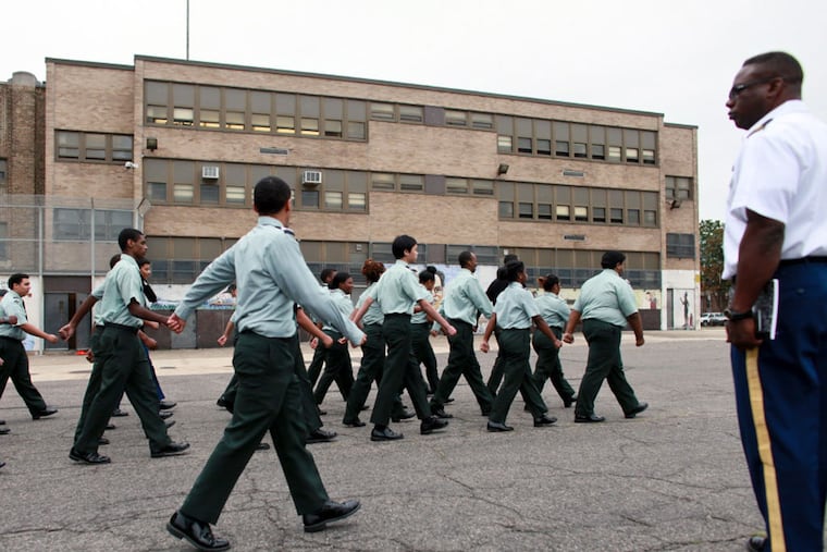 Students from Major Ken Roberts' Junior ROTC class drill in the school yard at Philadelphia Military Academy, Tuesday Oct. 1, 2015, in North Philadelphia. (Joseph Kaczmarek / For the Daily News)