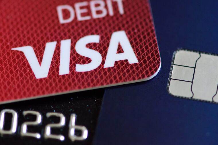 A Visa debit card is pictured with a chip-enabled card in Portland, Ore.,in 2016.