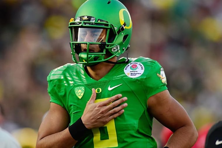 Oregon Ducks quarterback Marcus Mariota (8) runs off the field following the first half of the 2015 Rose Bowl college football game at Rose Bowl. (Robert Hanashiro/USA Today)